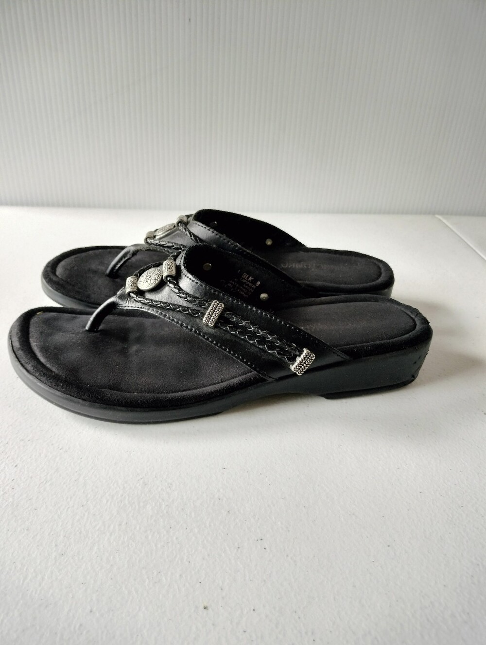 Minnetonka Black Braided Thong Sandals with Silver Accents
